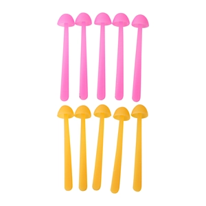 Close-up of pink and yellow silicone mushroom bookmarks with flexible long stems