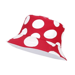 Red reversible bucket hat with large white polka dot mushroom pattern for outdoor sun protection