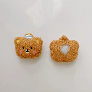 Detail of brown teddy plush bear pins with blue striped hats for DIY doll accessories