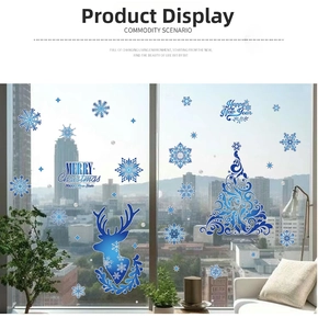 Detail view of blue Christmas elk and snowflake static window clings on glass pane