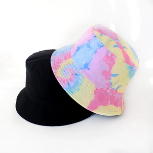 Close-up of black and tie-dye bucket hat showing stitching quality and cotton texture
