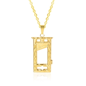 Macro shot of gold guillotine pendant with polished finish on mirrored surface