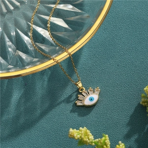 Gold stainless steel evil eye necklace with white enamel and clear cubic zirconia stones