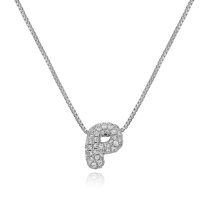 Macro detail of silver-tone letter P pendant necklace with sparkling cubic zirconia inlay