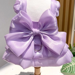 Detail of purple pet wedding dress with large bow and metal D-ring on mannequin