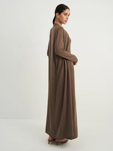 Detail of soft brown long-knit cardigan showing fine texture and elegant drape