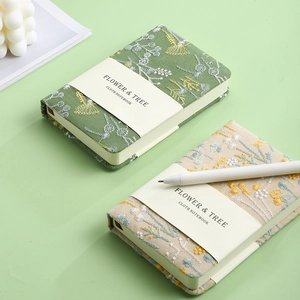 Retro linen A6 cloth notebooks with flower embroidery in green and beige colors