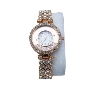 Women's rose gold watch with moving rhinestones and crystal encrusted metal strap