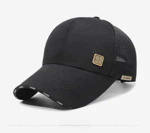 Detail of black trucker hat with gold Chinese badge and breathable mesh back