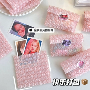Detail of pink heart-shaped bubble wrap protector for photo cards with waterproof texture