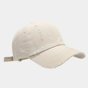 Detailed view of the distressed vintage cotton baseball cap with worn-out hole accents