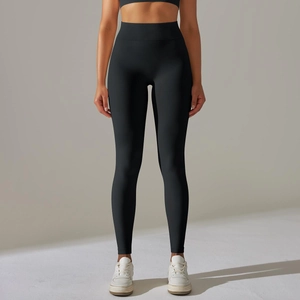 Close-up of seamless high-waisted black yoga leggings with supportive compression fabric