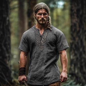 Men's Nordic Viking style grey short sleeve shirt with runes in a deep forest setting