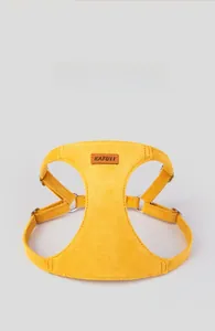 Close-up of ginger yellow microfiber pet harness with soft padded chest plate and D-ring