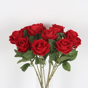 Velvet artificial red rose bouquet in a glass vase for home wedding decoration