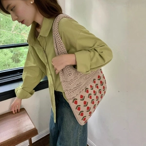 Beige crochet knit tote bag with red and green tulip floral patterns for summer vacation