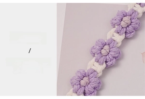 Detail of handcrafted purple daisy cotton cup strap showing the soft woven texture