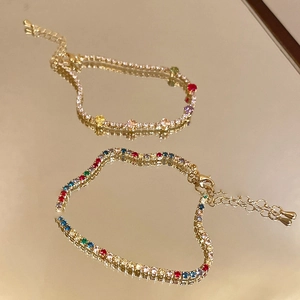 Elegant gold plated tennis bracelet featuring multi-color round cut cubic zirconia stones