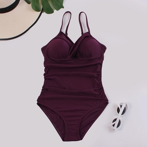 Detailed plum one-piece swimsuit featuring cross pleats and flattering side ruching detail