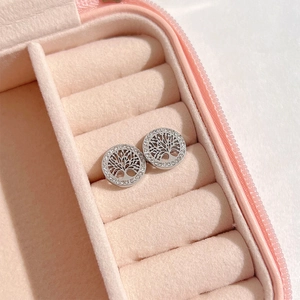 Silver Tree of Life stud earrings with crystals in a pink jewelry box display