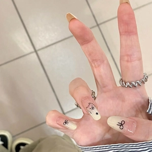 Cute cartoon gradient press-on nails with cat and bow tie designs in long coffin shape