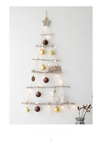 DIY wall-mounted wooden Christmas tree with LED lights, golden ornaments and star