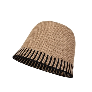 Fashionable beige striped knit bucket hat for women with a chic vertical stripe pattern