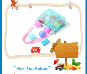 Detail of mesh beach bag for kids showing adjustable pink strap and colorful toy storage