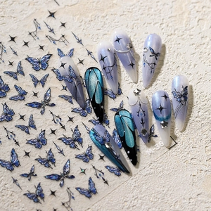 Blue butterfly nail stickers with gold stamping and celestial patterns for DIY manicure