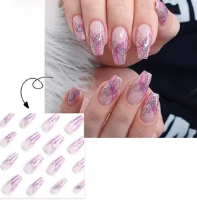 Detail of pink and purple ombre press-on nails with silver glitter and long coffin shape