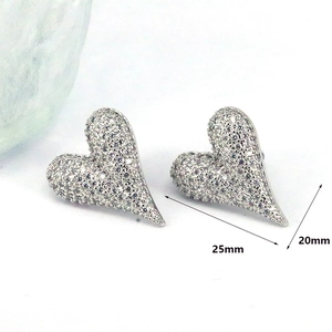 Detailed view of silver heart stud earrings featuring full crystal pavé and size dimensions