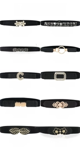 Detail view of various black elastic belts featuring diverse crystal and alloy buckle styles