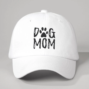Close-up of DOG MOM print with paw icon on white cotton baseball cap with curved brim