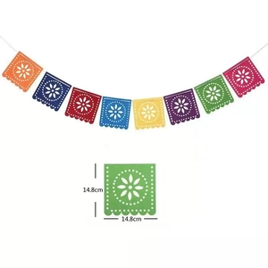 Detail of colorful felt Mexican Papel Picado banner with hollow floral patterns and dimensions