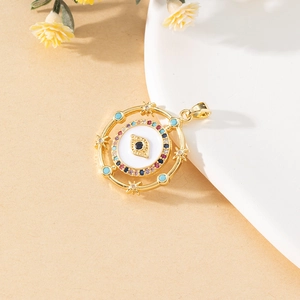 Macro detail of a gold evil eye pendant with colorful gemstones and enamel finish