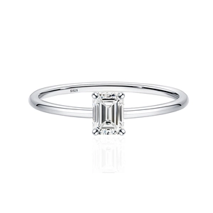 Minimalist S925 sterling silver ring with emerald cut rectangular moissanite on white background