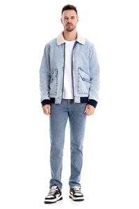 Detailed shot of men's fleece-lined denim jacket with white faux fur collar and ribbed hem