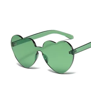 Rimless heart shaped sunglasses with green gradient lenses and thin black frames