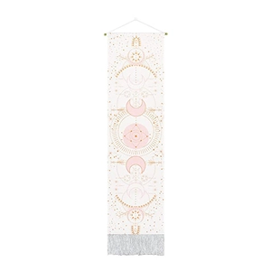Detail of bohemian celestial tapestry showing pink moon phases and sunburst gold patterns
