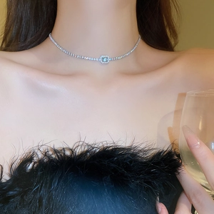 Detail of square zircon pendant on full diamond silver choker necklace worn by model