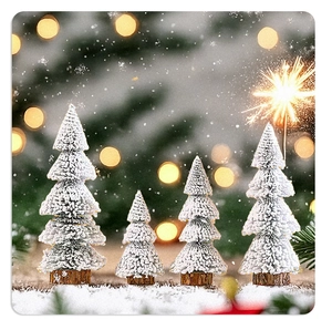 Set of four mini snow-flocked Christmas trees with natural wood bases on a festive table