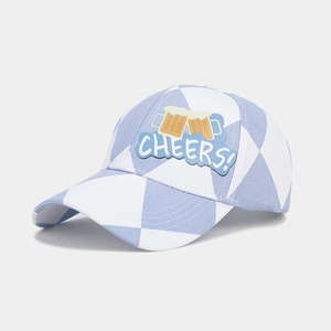 Detail of the blue and white checkered Oktoberfest baseball cap featuring a Cheers embroidery