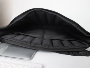Detail of black laptop sleeve featuring shockproof air cushion lining for protection