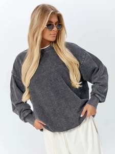 Detail of vintage washed charcoal cotton sweatshirt featuring dropped shoulders and ribbed cuffs