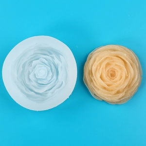 Macro detail of 3D rose silicone mold with finished wax candle and floral textures