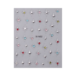 3D silver nail stickers with colorful rhinestones in star patterns on grey paper