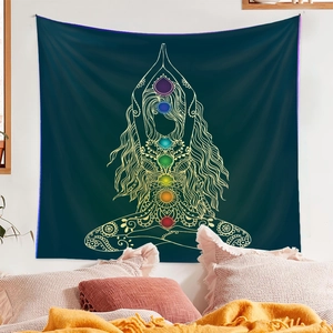 Detail of yoga chakra tapestry showing lotus pose woman and colorful energy centers