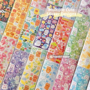 Close-up of vibrant laser glitter stickers with cute cartoon bears and rabbits