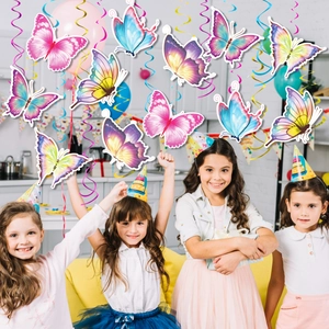 Vibrant butterfly swirl decorations hanging in a joyful party scene with girls