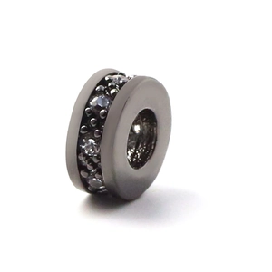 Macro detail of copper spacer bead with micro-pave cubic zirconia in dark gray finish